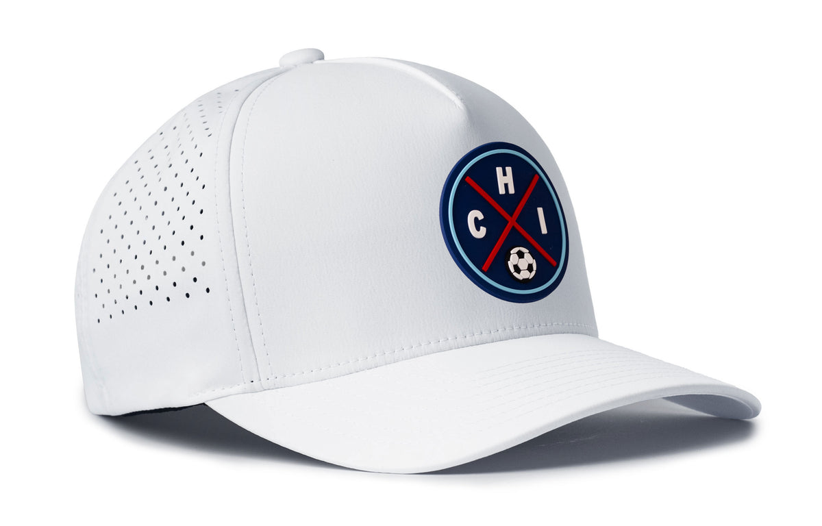 white performance 5-panel hat viewed from the right side, showcasing a bold red and blue pvc patch prominently displayed on the front