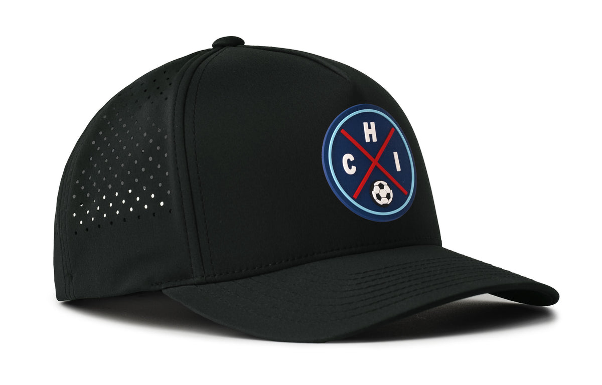 black performance 5-panel hat viewed from the right side, showcasing a bold red and blue pvc patch prominently displayed on the front