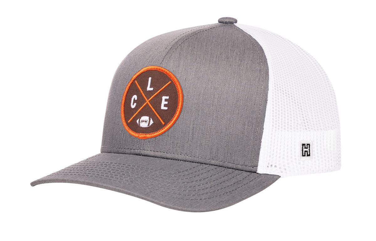 Cleveland Football Trucker Hat, gray-white snapback showing Haka brandmark on left side of cap.