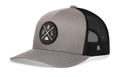 Colorado Trucker Hat, gray-black snapback showing Haka brandmark on left side of cap.