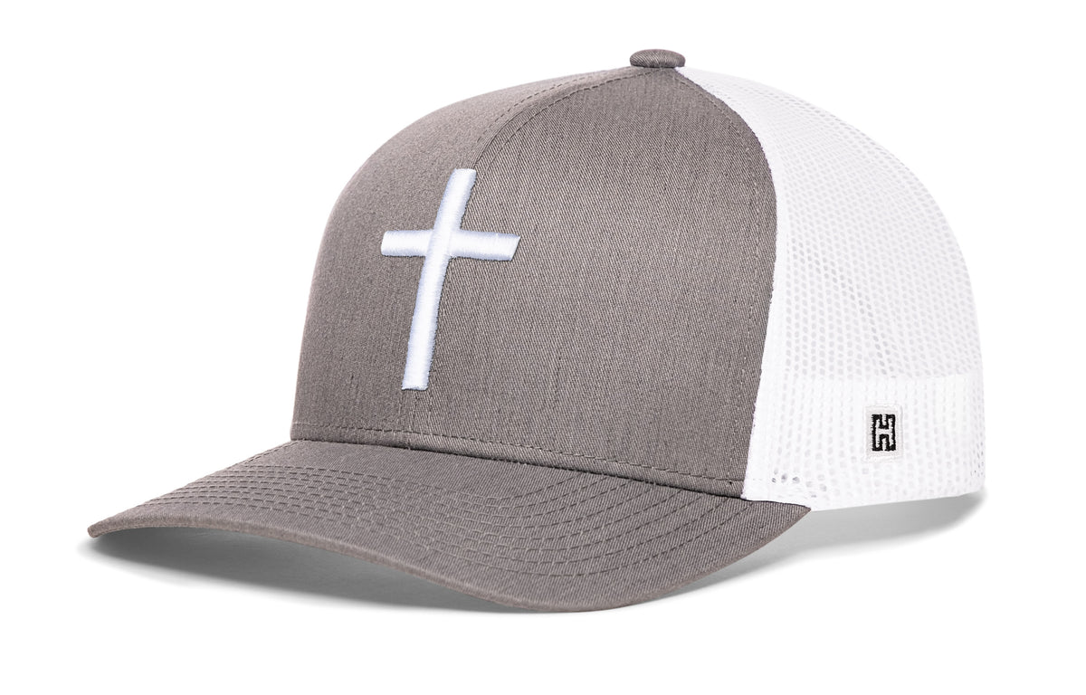 Cross Trucker Hat, gray-white snapback showing Haka brandmark on left side of cap.