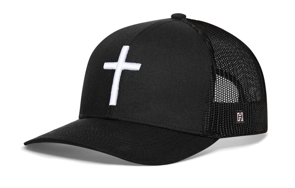 Cross Trucker Hat, black snapback showing Haka brandmark on left side of cap.