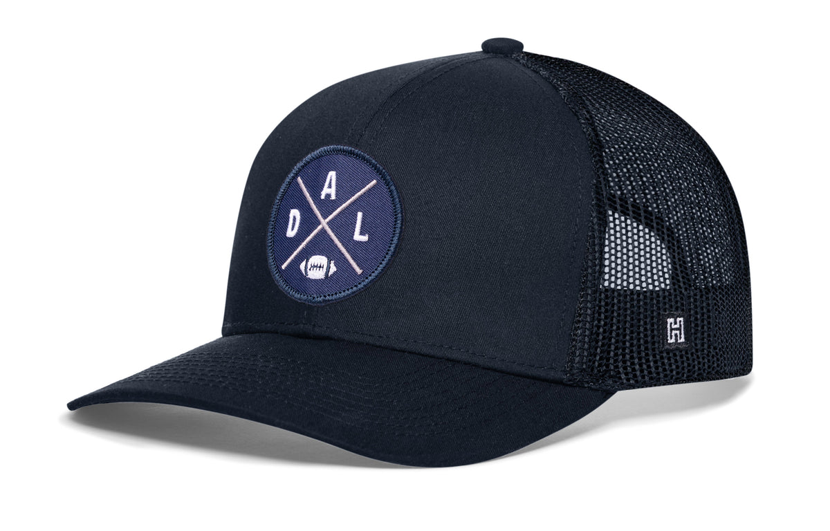 Dallas Football Trucker Hat, navy snapback showing Haka brandmark on left side of cap.
