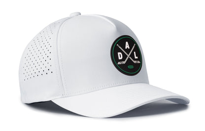 white performance 5-panel hat viewed from the right side, showcasing a bold black, green and gray pvc patch prominently displayed on the front