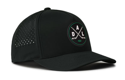 black performance 5-panel hat viewed from the right side, showcasing a bold black, green and gray pvc patch prominently displayed on the front