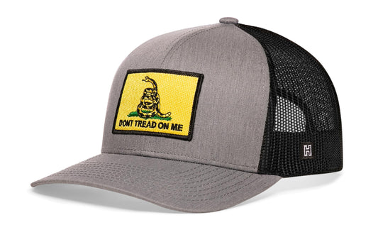 Dont Tread On Me Trucker Hat, gray-black snapback showing Haka brandmark on left side of cap.