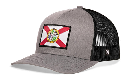 Florida Flag Trucker Hat, gray-black snapback showing Haka brandmark on left side of cap.
