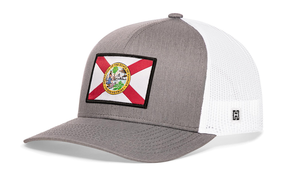 Florida Flag Trucker Hat, gray-white snapback showing Haka brandmark on left side of cap.