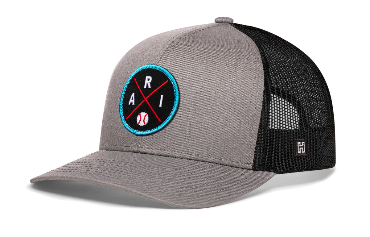 Arizona trucker hat, gray-black snapback showing Haka brandmark on left side mesh.
Rep Arizona.