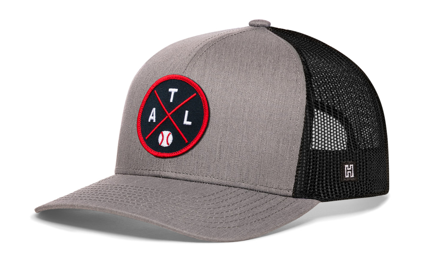 Atlanta trucker hat, gray-black snapback showing Haka brandmark on left side mesh.
Rep Atlanta, GA.