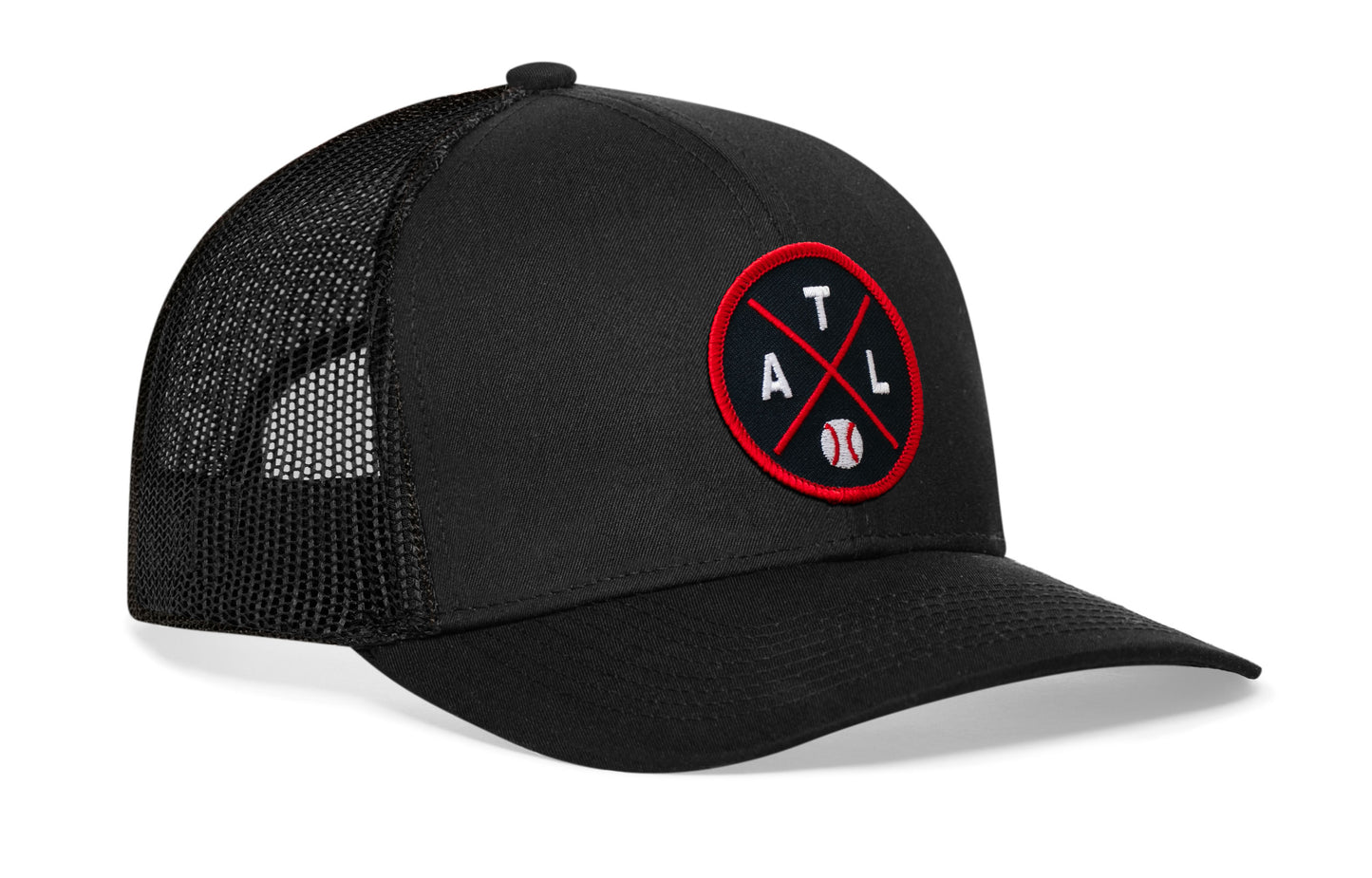 black trucker hat viewed from the right side, showcasing a navy and red baseball embroidered X patch prominently displayed on the front