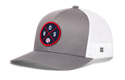 Boston trucker hat, gray-white snapback showing Haka brandmark on left side mesh.
Rep Boston, MA.