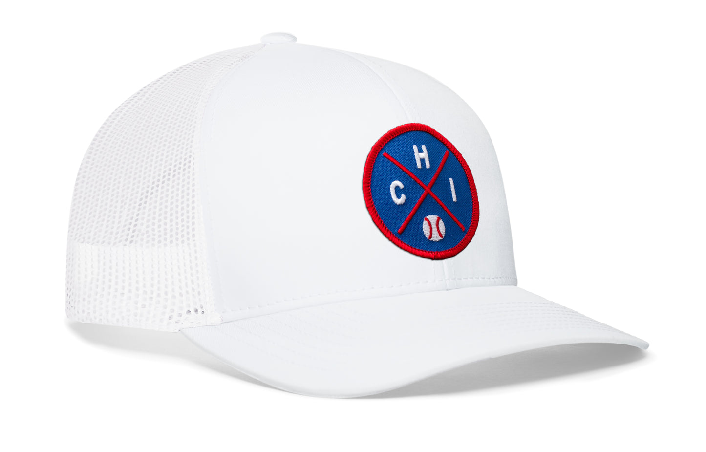 white trucker hat viewed from the right side, showcasing a royal and red baseball embroidered X patch prominently displayed on the front