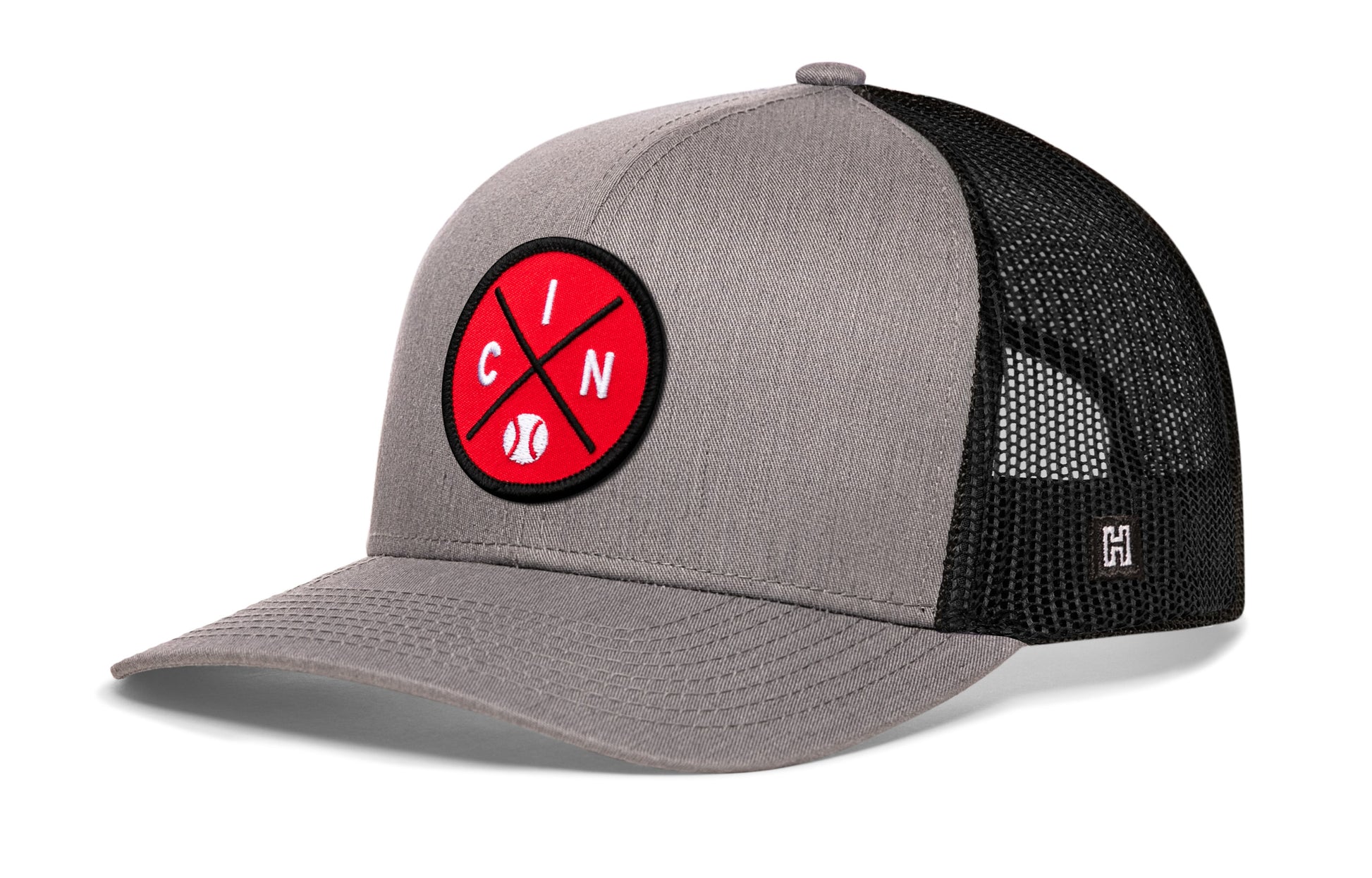Cincinnati trucker hat, gray-black snapback showing Haka brandmark on left side mesh.
Rep Cincinnati, OH.