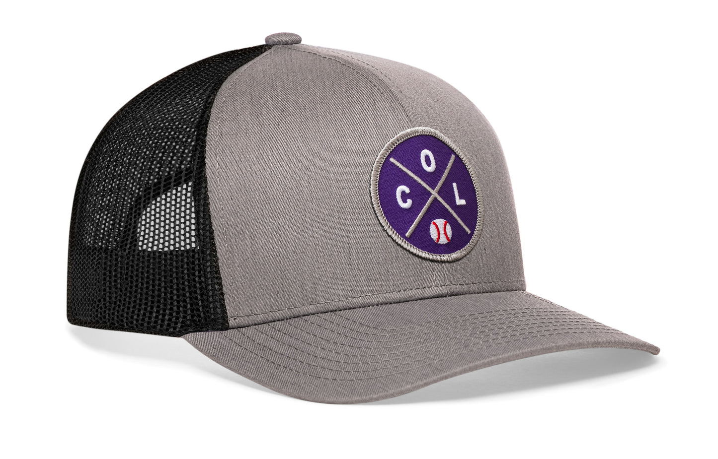 gray-black trucker hat viewed from the right side, showcasing a bold purple and gray embroidered X patch prominently displayed on the front