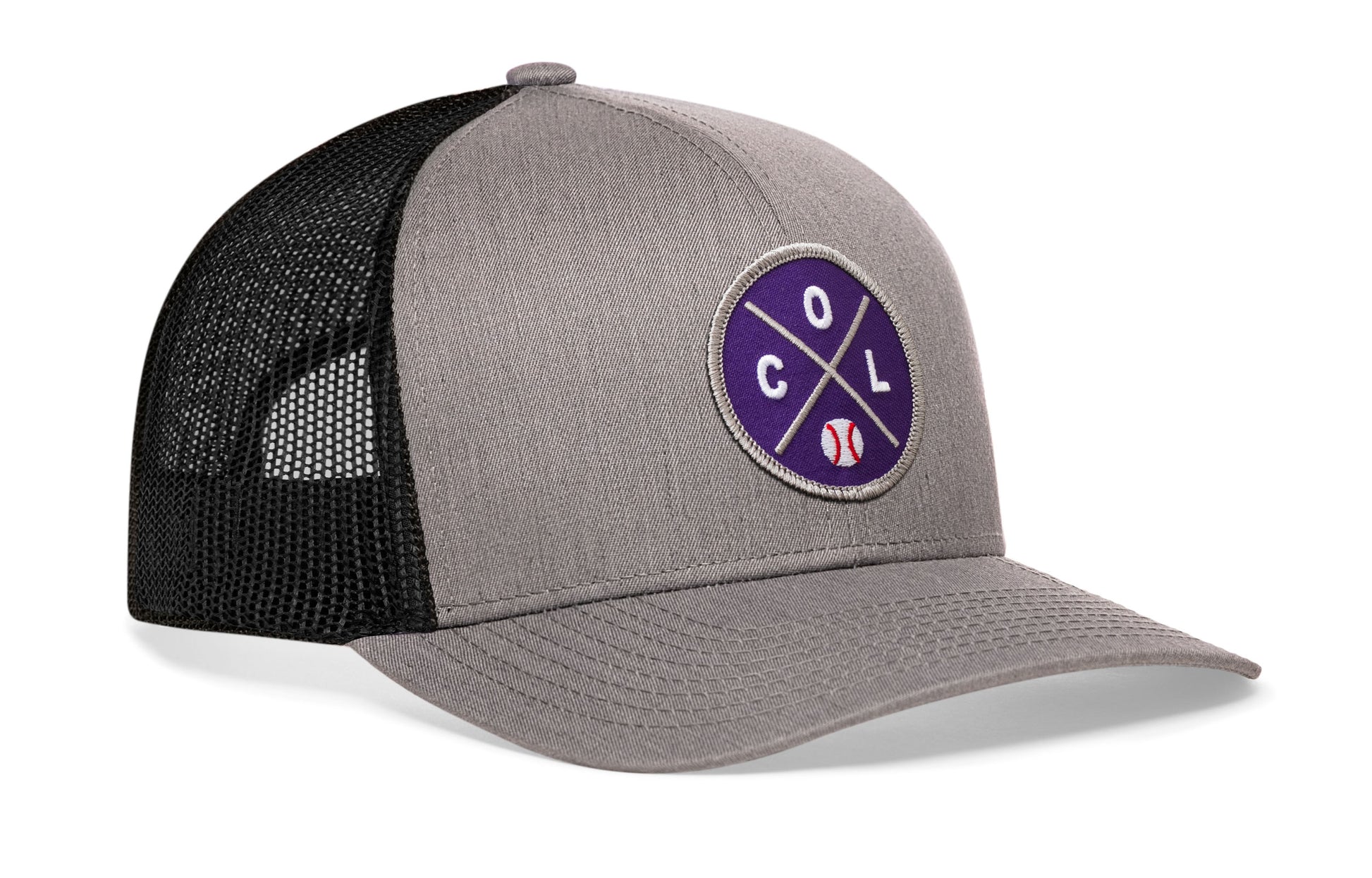 gray-black trucker hat viewed from the right side, showcasing a bold purple and gray embroidered X patch prominently displayed on the front