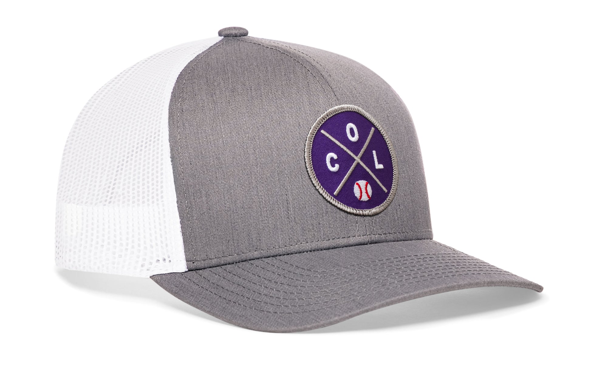 gray-white trucker hat viewed from the right side, showcasing a bold purple and gray embroidered X patch prominently displayed on the front