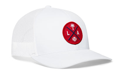 white trucker hat viewed from the right side, showcasing a red and navy baseball embroidered X patch prominently displayed on the front
