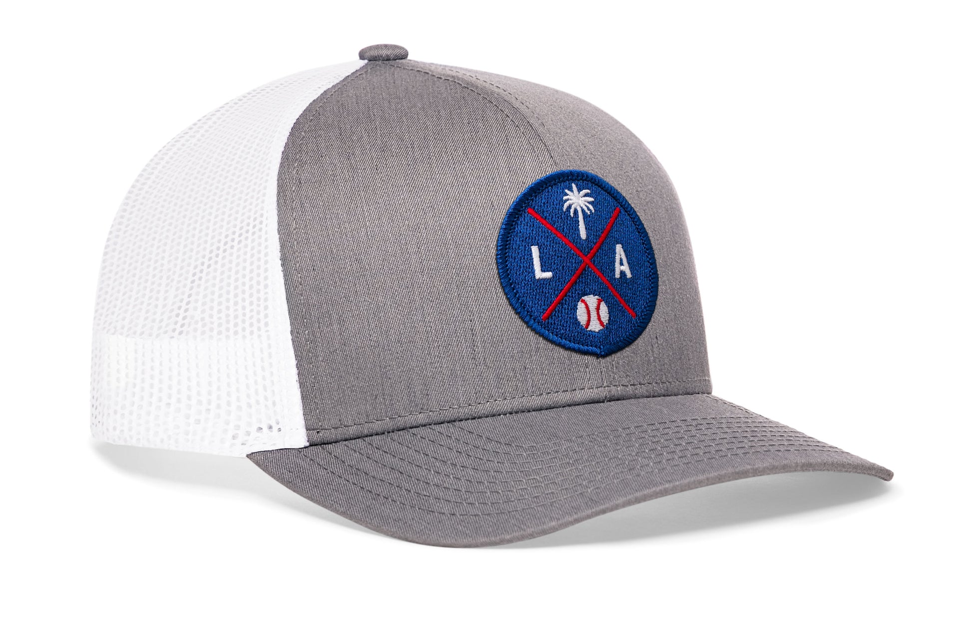 gray-white trucker hat viewed from the right side, showcasing a bold royal and red embroidered X patch prominently displayed on the front