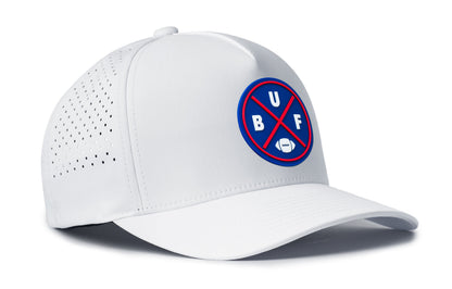 white trucker hat viewed from the right side, showcasing a bold royal and red pvc patch prominently displayed on the front