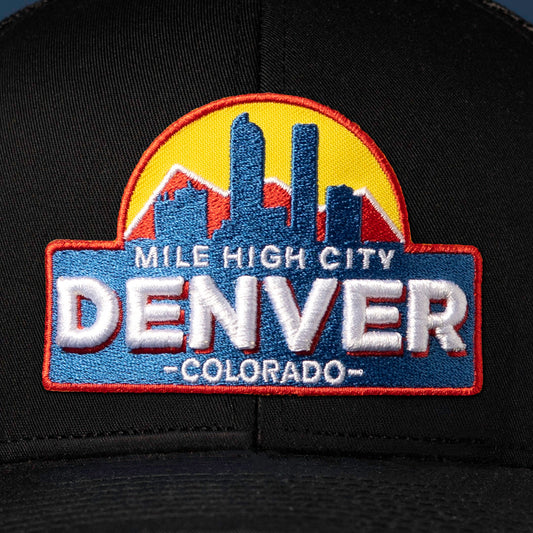 Up close embroidery detail showcasing a Denver Cityscape Embroidered Patch prominently displayed on the front