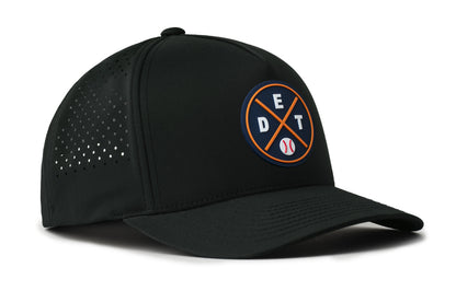 black performance 5-panel hat viewed from the right side, showcasing a bold navy and orange pvc patch prominently displayed on the front