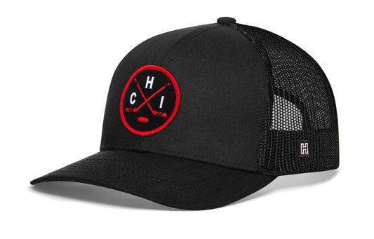 Chicago hockey trucker hat, black snapback showing Haka brandmark on left side mesh of cap.
Rep Chicago hockey.