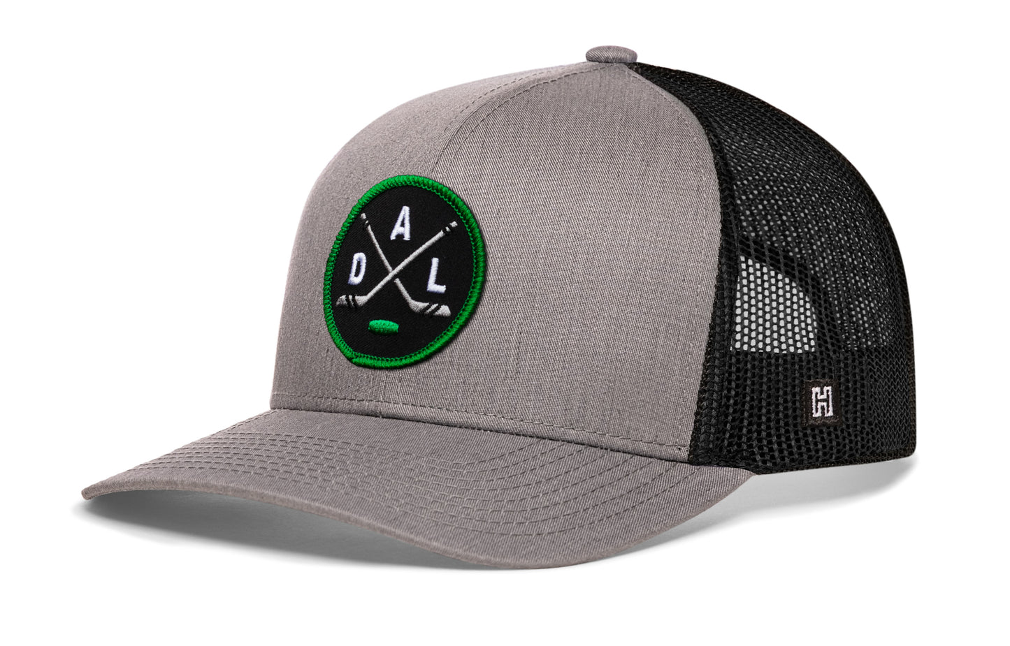 Dallas hockey trucker hat, gray-black snapback showing Haka brandmark on left side mesh.
Rep Dallas hockey.