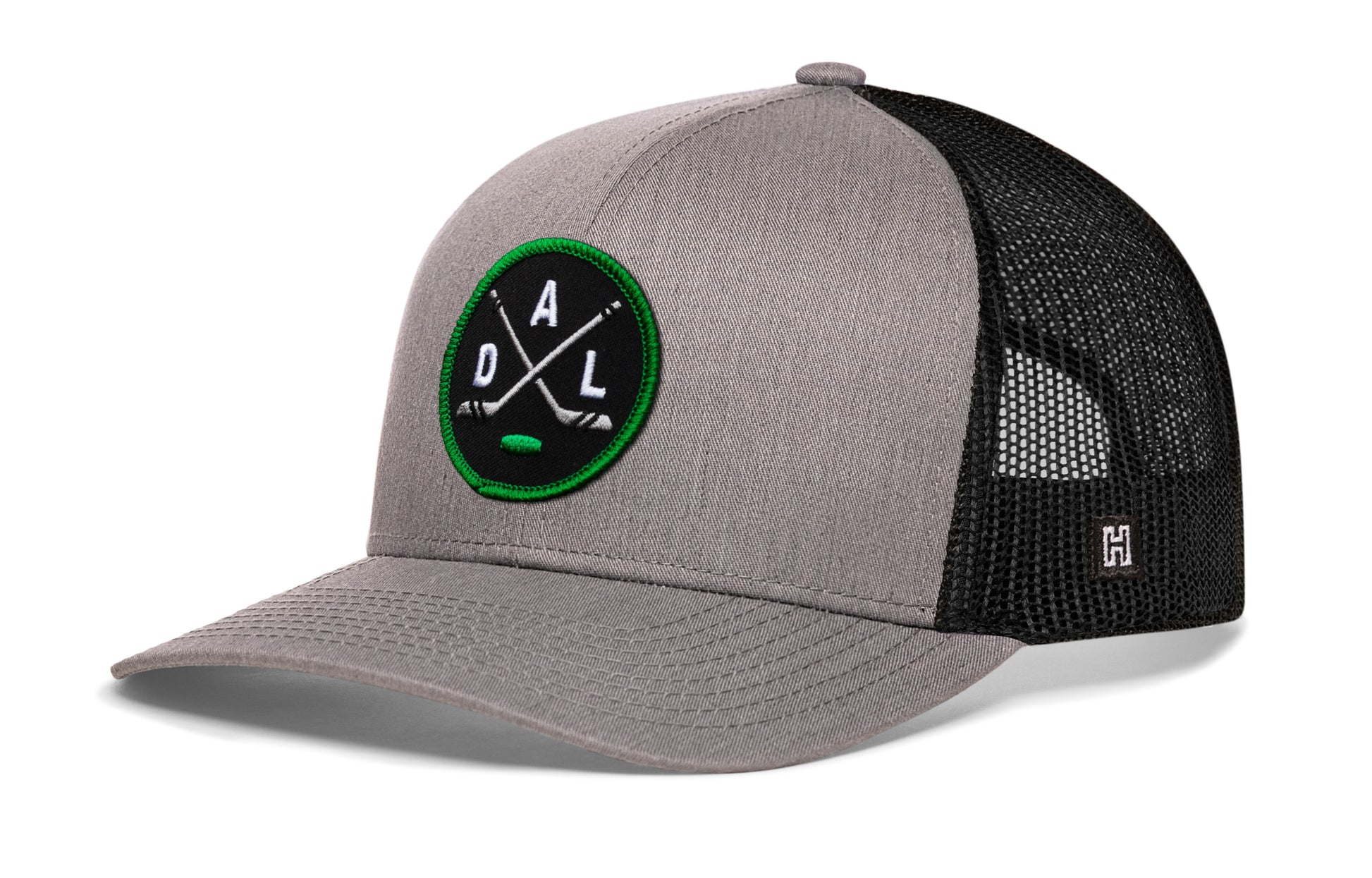 Dallas hockey trucker hat, gray-black snapback showing Haka brandmark on left side mesh.
Rep Dallas hockey.