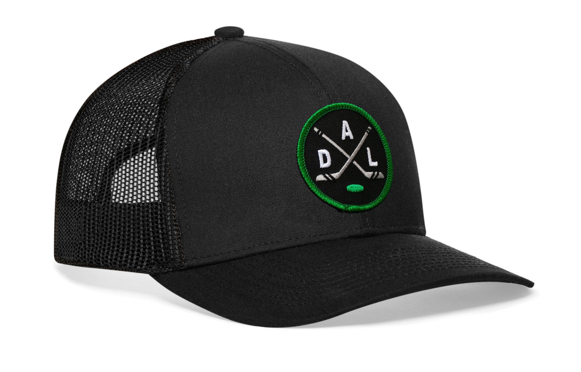 black trucker hat viewed from the right side, showcasing a black, green and gray hockey embroidered X patch prominently displayed on the front