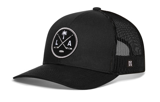 Los Angeles Hockey Trucker Hat, black snapback showing Haka brandmark on left side of cap.