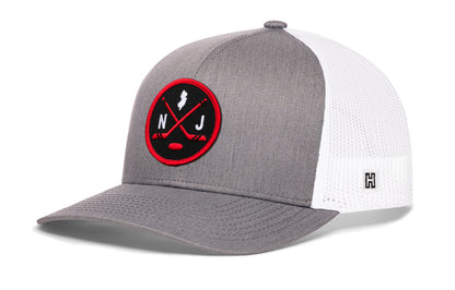 New Jersey hockey trucker hat, gray-white snapback showing Haka brandmark on left side mesh.
Rep New Jersey hockey.