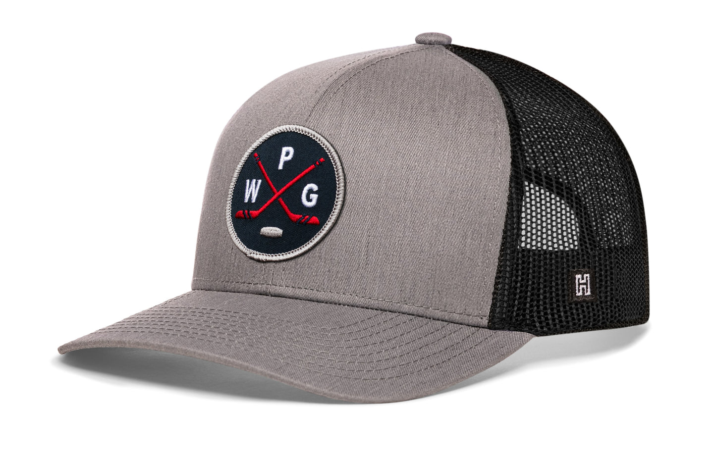 Winnipeg hockey trucker hat, gray-black snapback showing Haka brandmark on left side mesh.
Rep Winnipeg hockey.