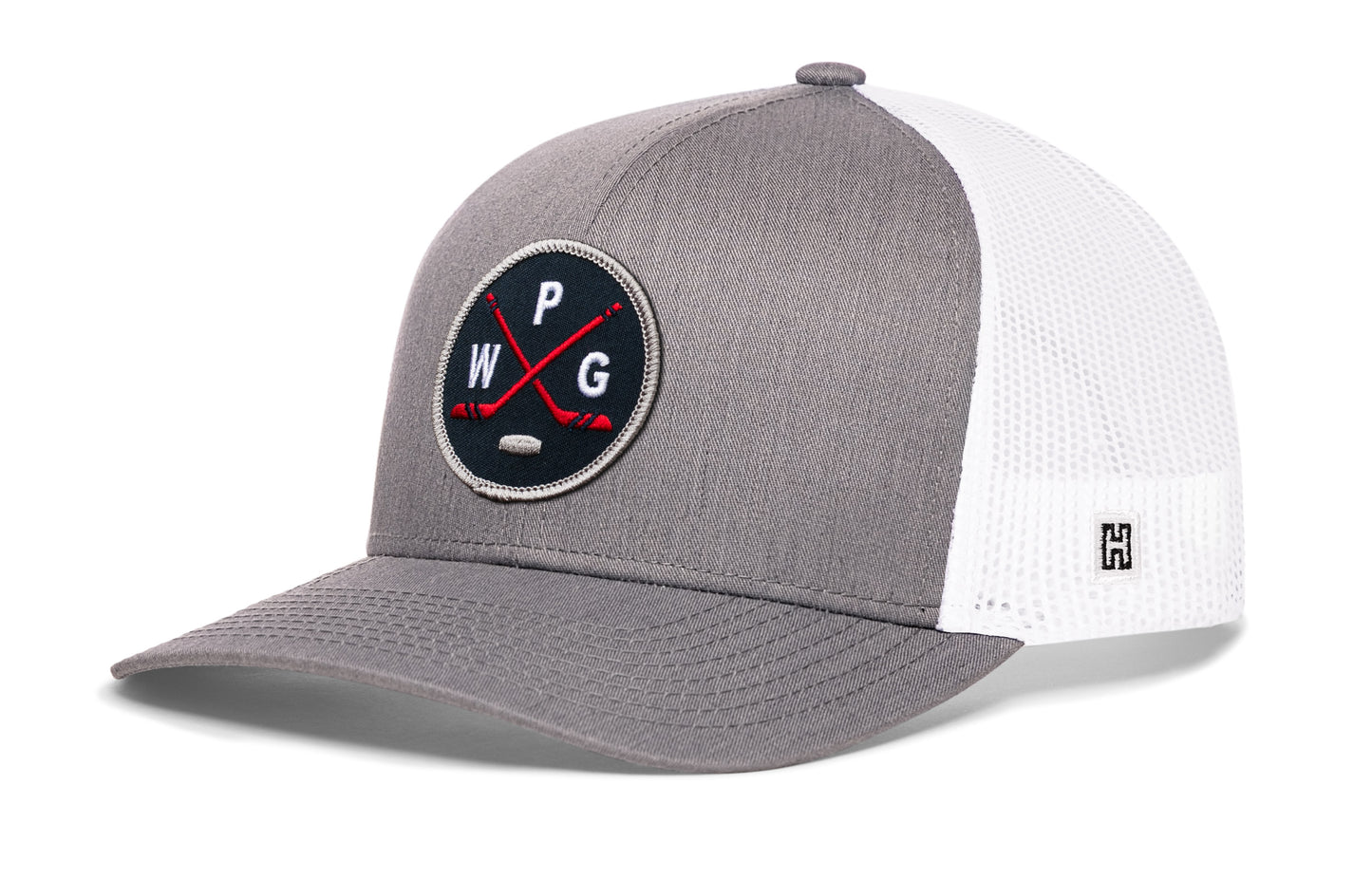 Winnipeg hockey trucker hat, gray-white snapback showing Haka brandmark on left side mesh.
Rep Winnipeg hockey.