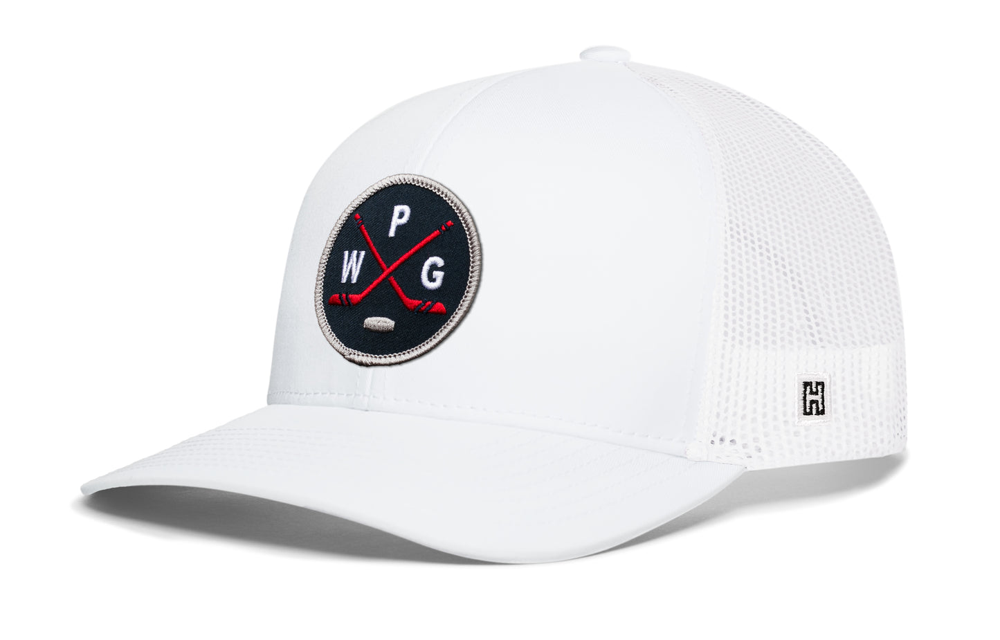 Winnipeg hockey trucker hat, white snapback showing Haka brandmark on left side mesh of cap.
Rep Winnipeg hockey.
