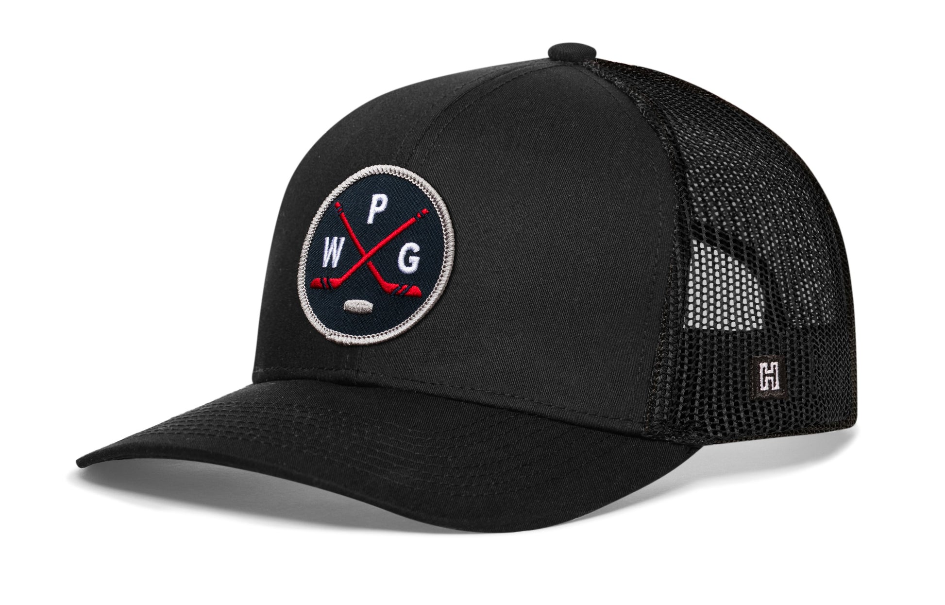Winnipeg hockey trucker hat, black snapback showing Haka brandmark on left side mesh of cap.
Rep Winnipeg hockey.