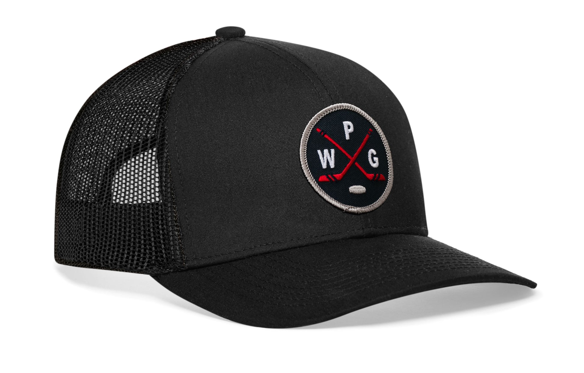 black trucker hat viewed from the right side, showcasing a navy, red and gray hockey embroidered X patch prominently displayed on the front