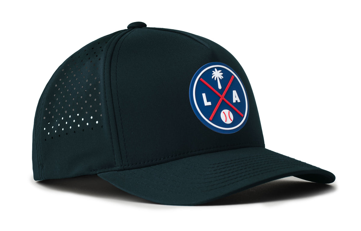 navy performance 5-panel hat viewed from the right side, showcasing a bold royal and red pvc patch prominently displayed on the front
