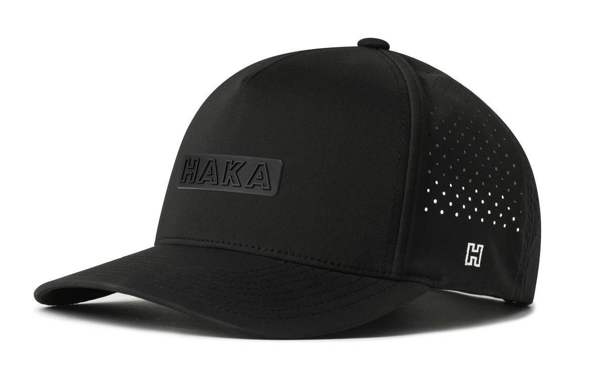 HAKA Performance 5-Panel Hat, black snapback showing Haka brandmark on left side of cap.
