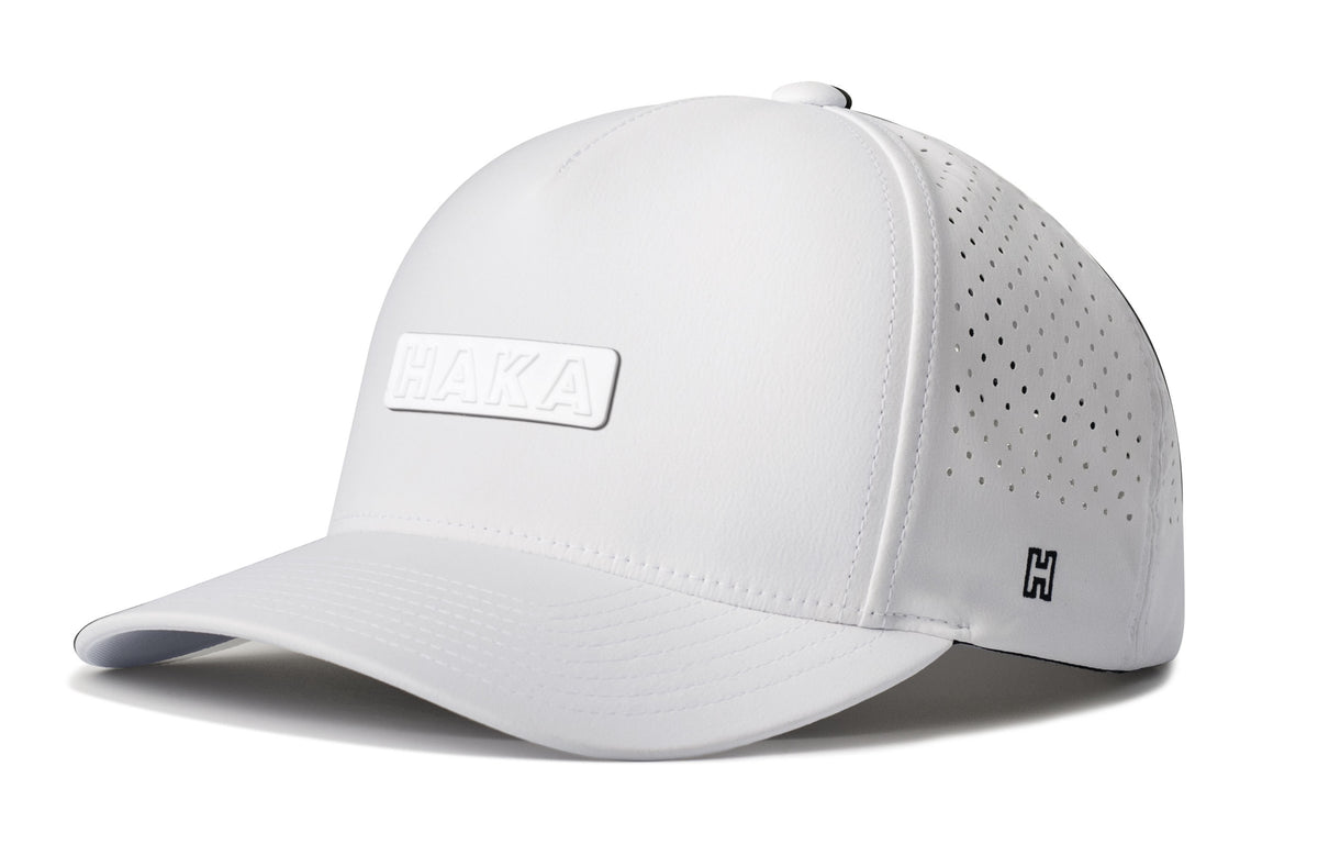 HAKA Performance 5-Panel Hat, white snapback showing Haka brandmark on left side of cap.