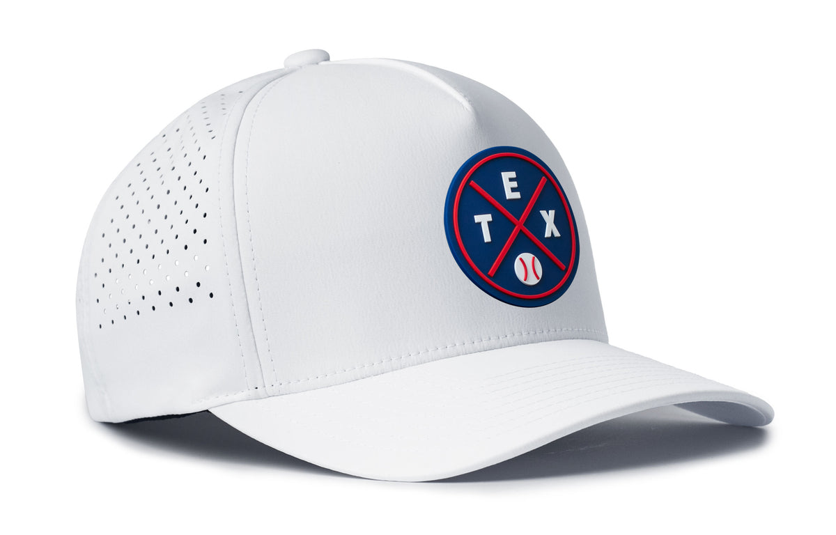 white performance 5-panel hat viewed from the right side, showcasing a bold navy and red pvc patch prominently displayed on the front