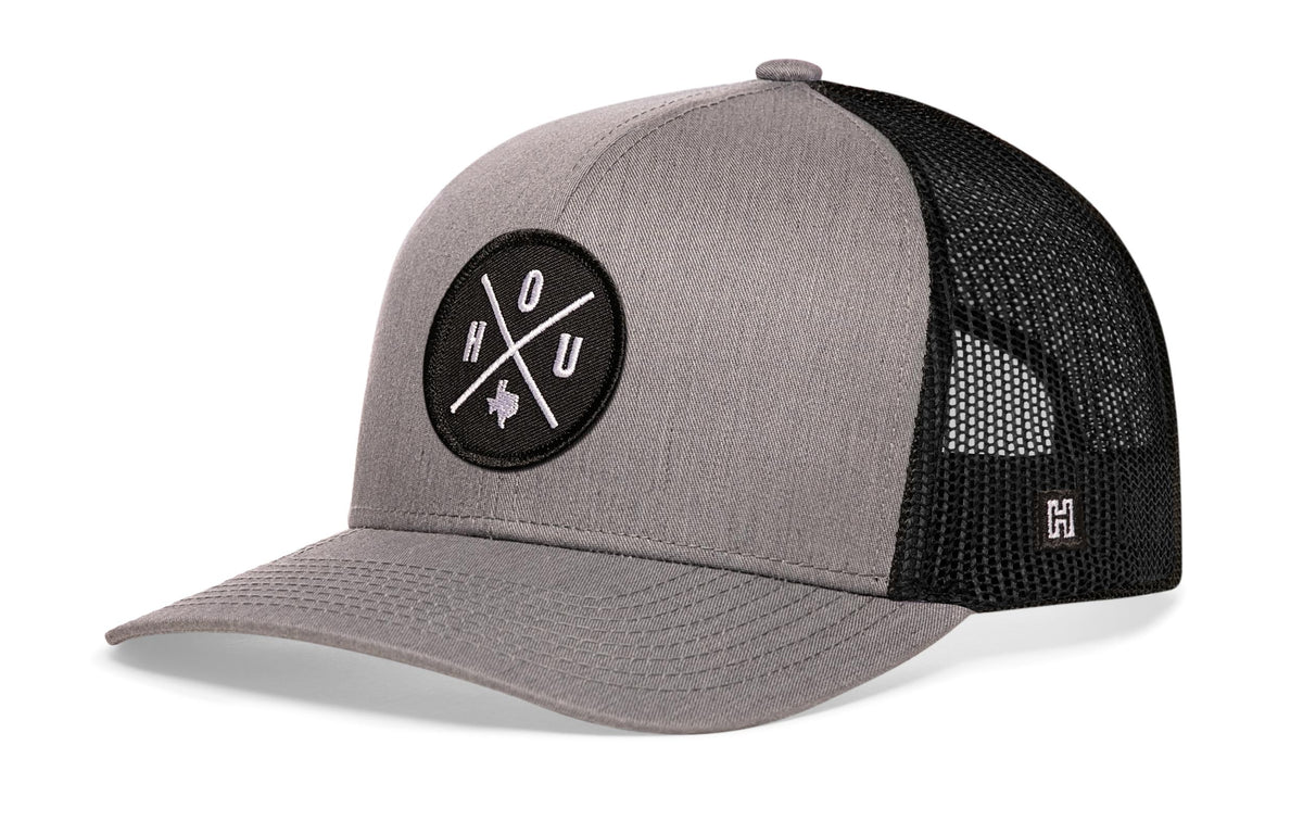 Houston Trucker Hat, gray-black snapback showing Haka brandmark on left side of cap.