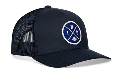 navy trucker hat viewed from the right side, showcasing a bold blue and white embroidered X patch prominently displayed on the front