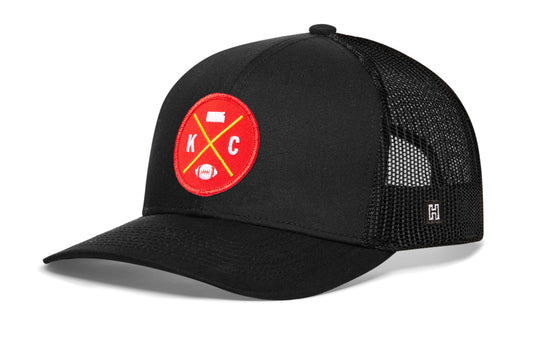 Kansas City Football Trucker Hat, black snapback showing Haka brandmark on left side of cap.