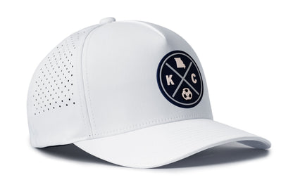 white performance 5-panel hat viewed from the right side, showcasing a bold sky blue and navy pvc patch prominently displayed on the front