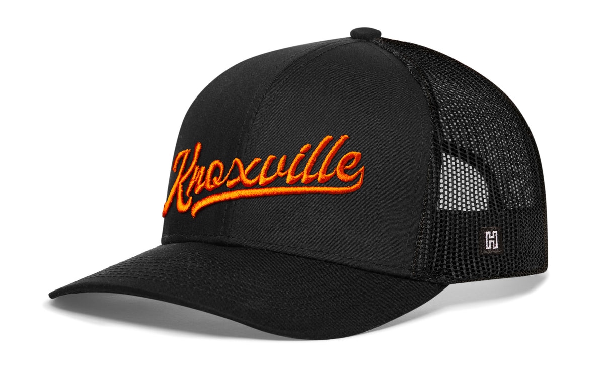 Knoxville Trucker Hat, black snapback showing Haka brandmark on left side of cap.