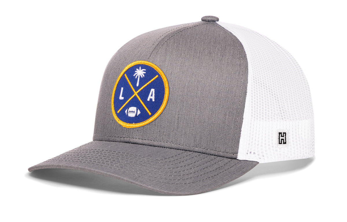 Los Angeles Football Trucker Hat, gray-white snapback showing Haka brandmark on left side of cap.