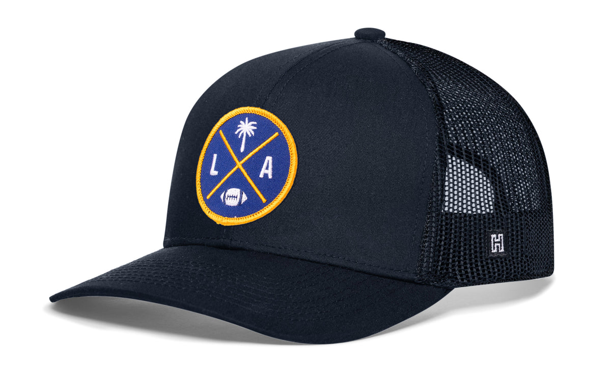 Los Angeles Football Trucker Hat, navy snapback showing Haka brandmark on left side of cap.