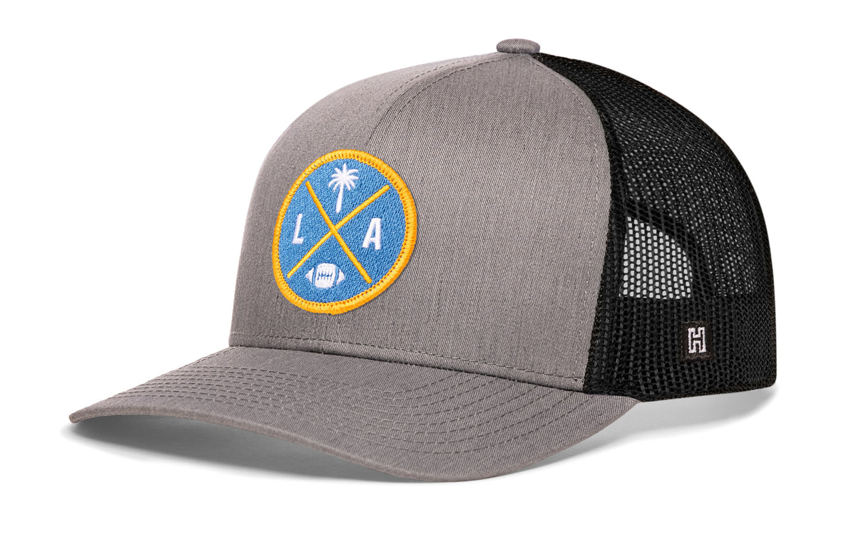 Los Angeles Football Trucker Hat, gray-black snapback showing Haka brandmark on left side of cap.