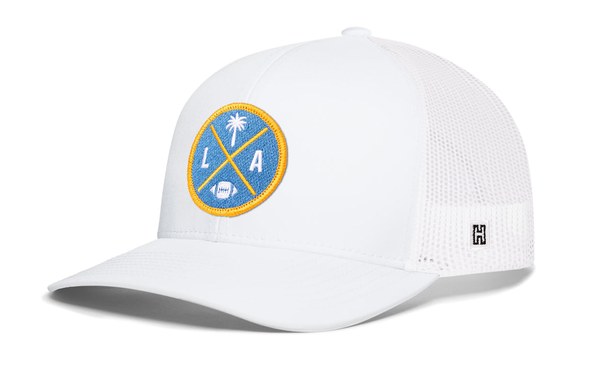Los Angeles Football Trucker Hat, white snapback showing Haka brandmark on left side of cap.